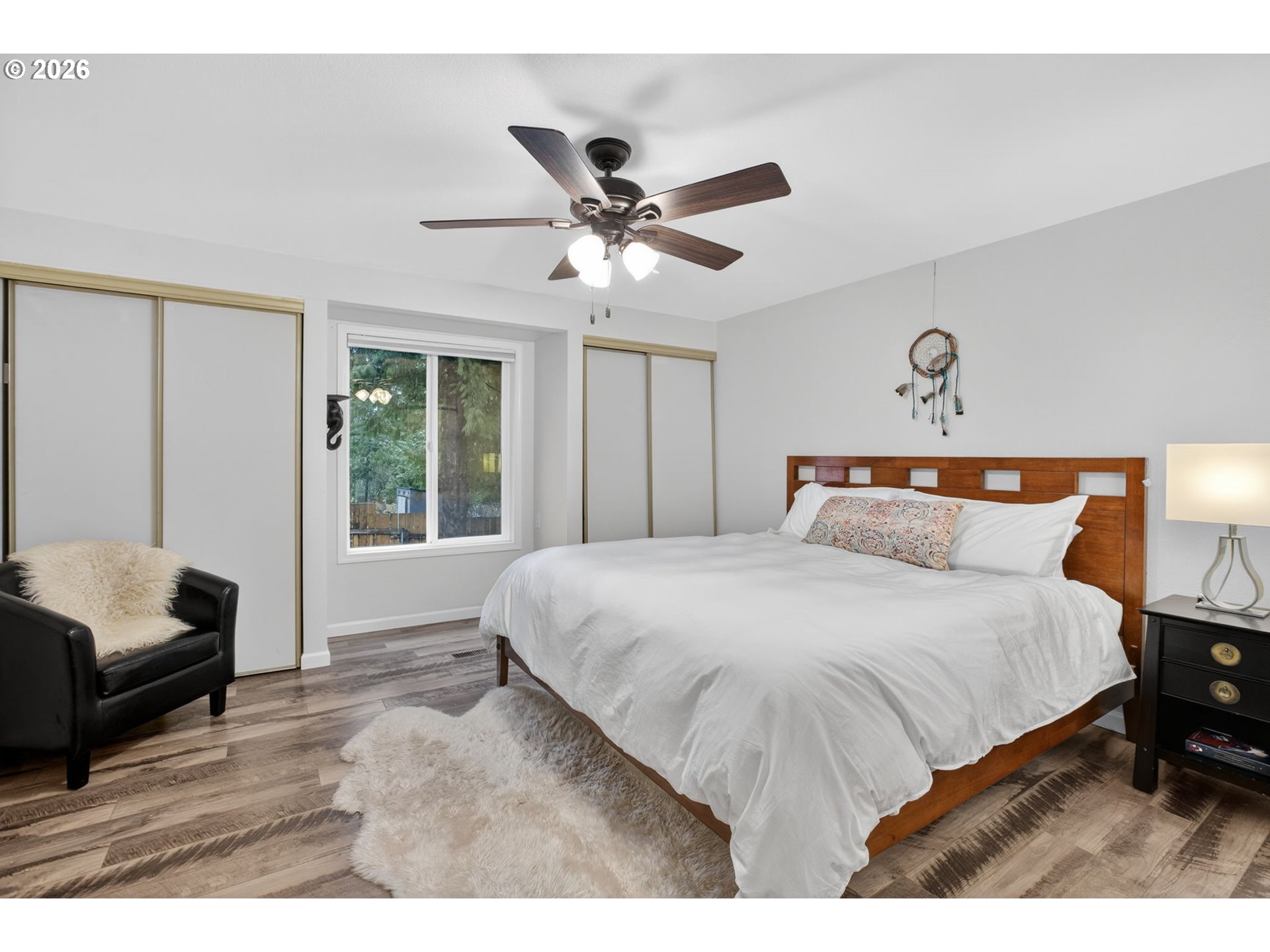 4721 Southwest 45th Avenue Portland, OR 97221 - Photo 15 of 29 a bedroom with a large bed and a couch