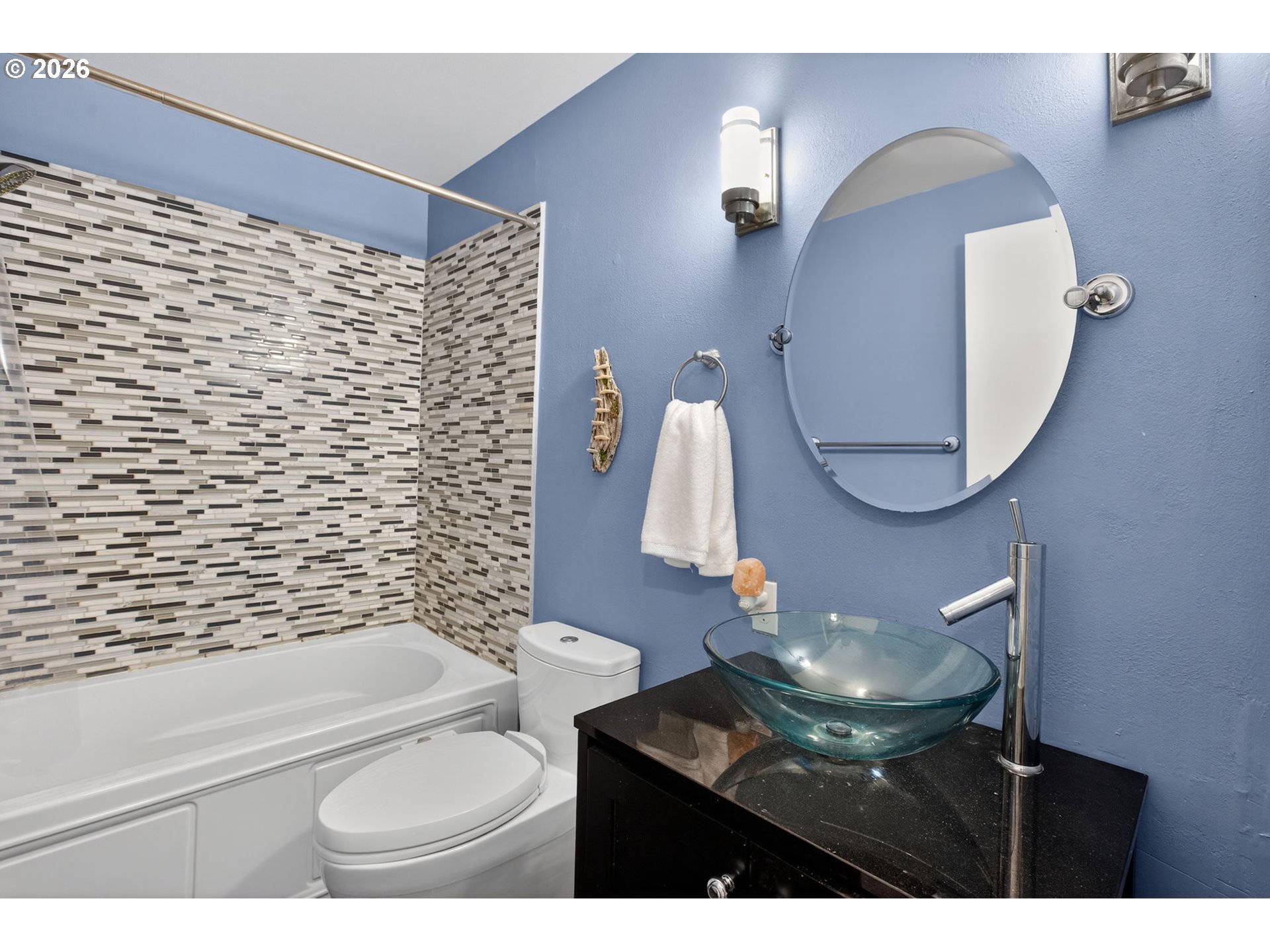 4721 Southwest 45th Avenue Portland, OR 97221 - Photo 20 of 29 a bathroom with a sink a toilet and a mirror