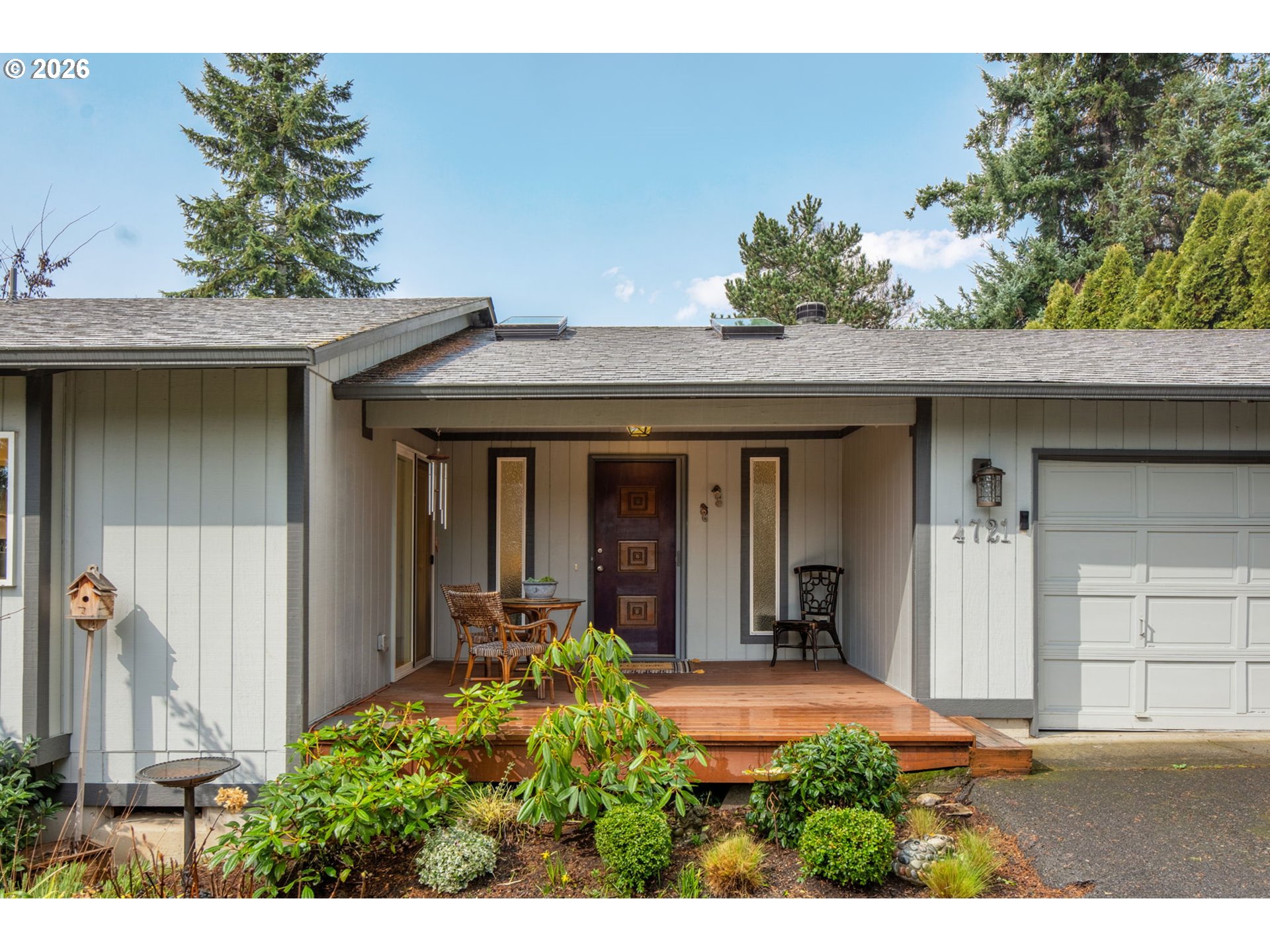 4721 Southwest 45th Avenue Portland, OR 97221 - Photo 2 of 29 a front view of a house with a yard