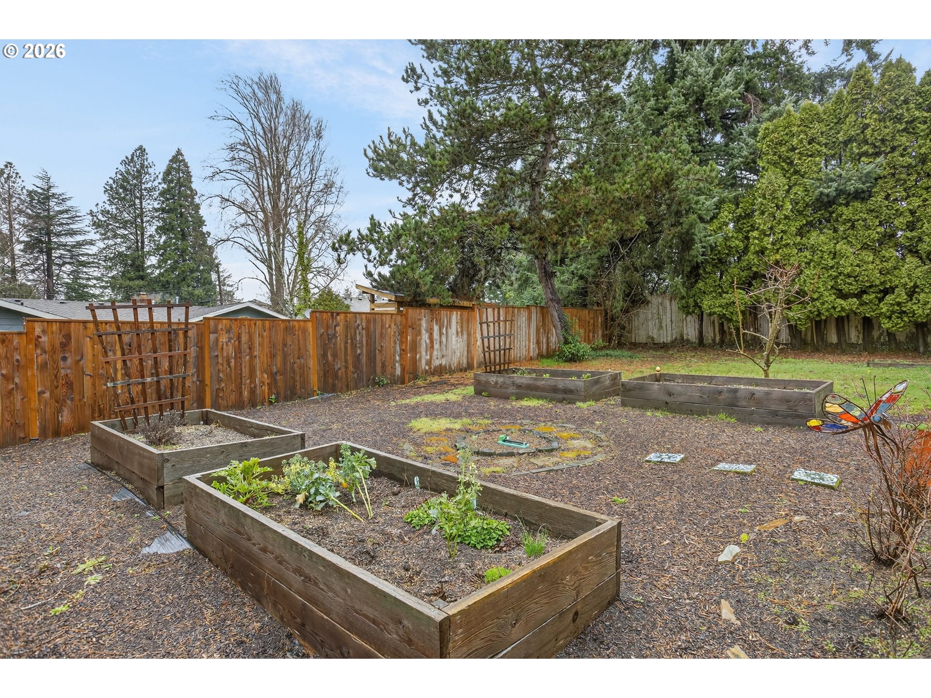 4721 Southwest 45th Avenue Portland, OR 97221 - Photo 25 of 29 a view of a backyard with wooden fence
