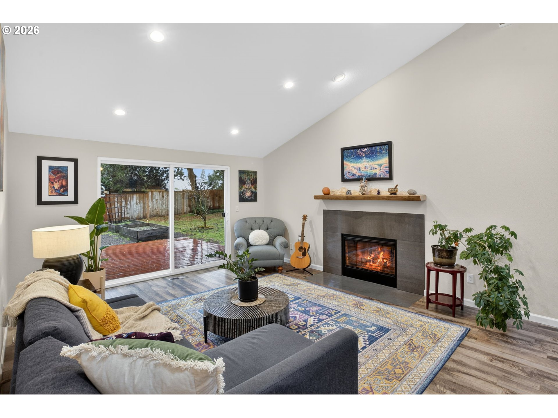 4721 Southwest 45th Avenue Portland, OR 97221 - Photo 6 of 29 a living room with furniture and a fireplace