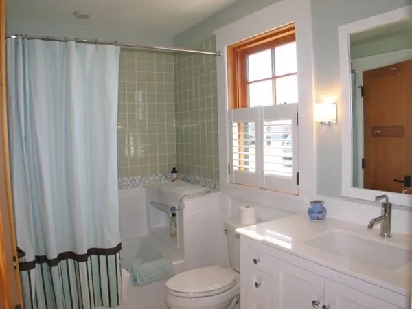 a bathroom with a sink a toilet and tub