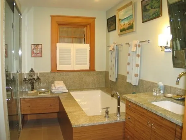 a bathroom with a shower and a sink