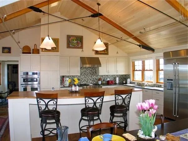 a kitchen with stainless steel appliances granite countertop a sink and cabinets