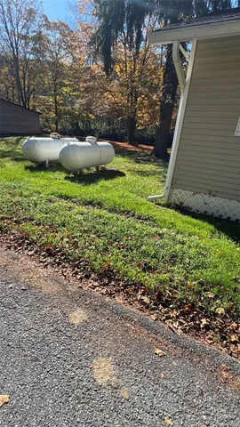 a backyard of a house with lots of green space