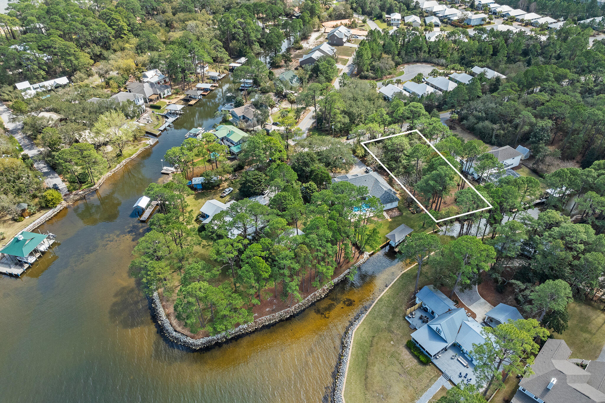 Lot 18 West Hewett Road Santa Rosa Beach, FL 32459 - Photo 7 of 9 an aerial view of a house a yard and a lake view