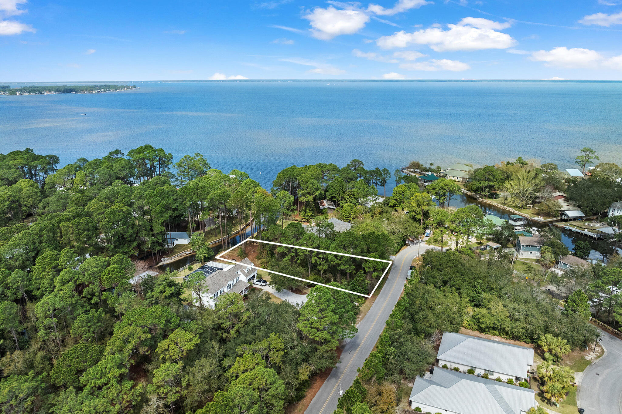 Lot 18 West Hewett Road Santa Rosa Beach, FL 32459 - Photo 8 of 9 a view of a lake and a yard