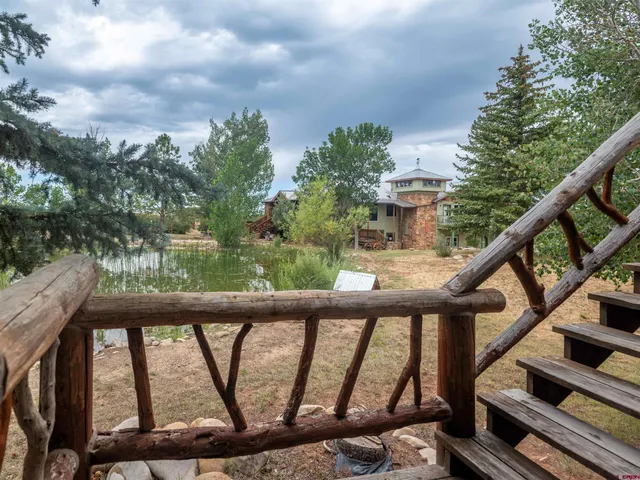 an aerial view of a house with a yard and plants