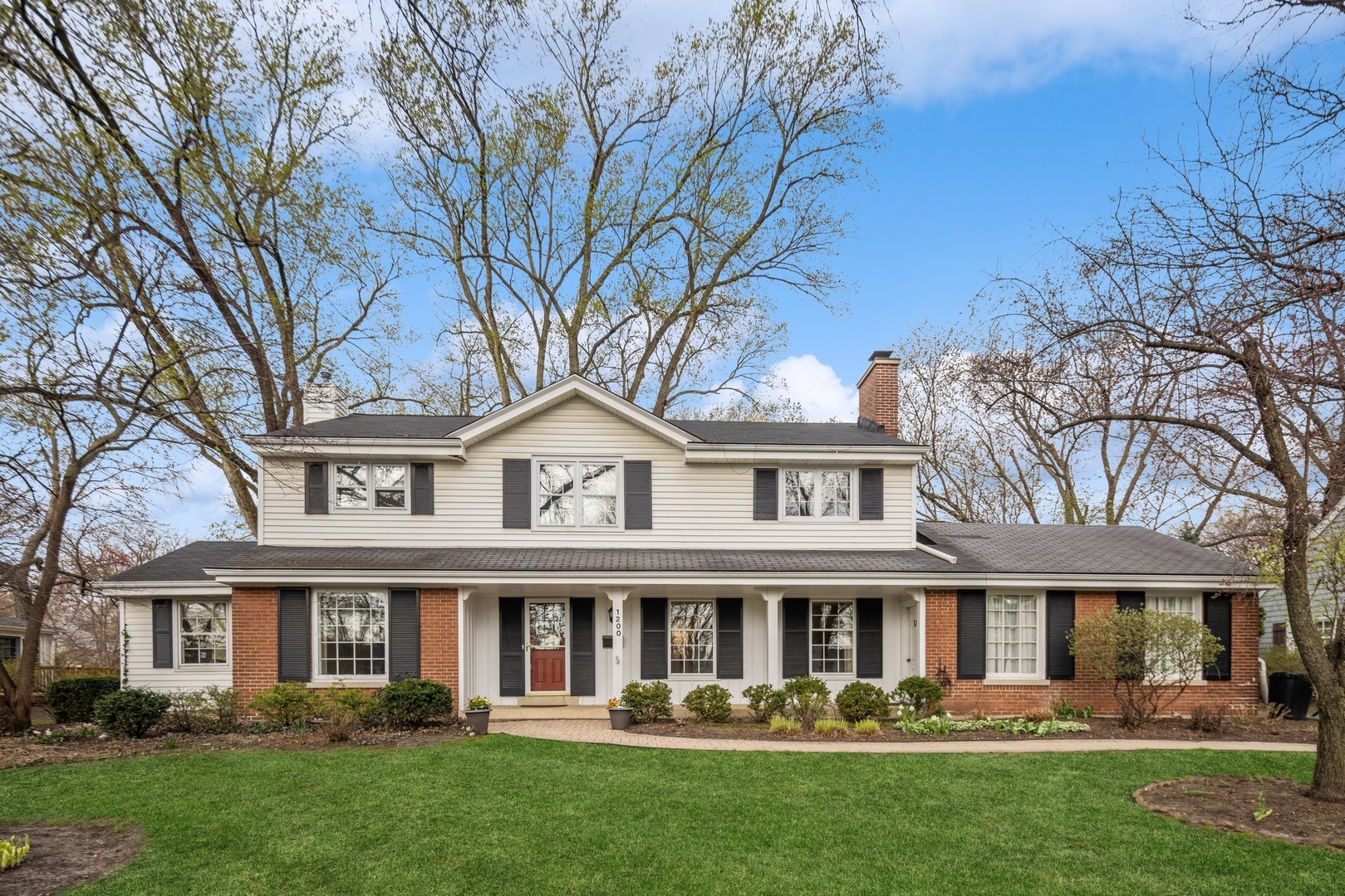1200 Woodview Road Burr Ridge, IL 60527 - Photo 1 of 22 front view of a house with a yard