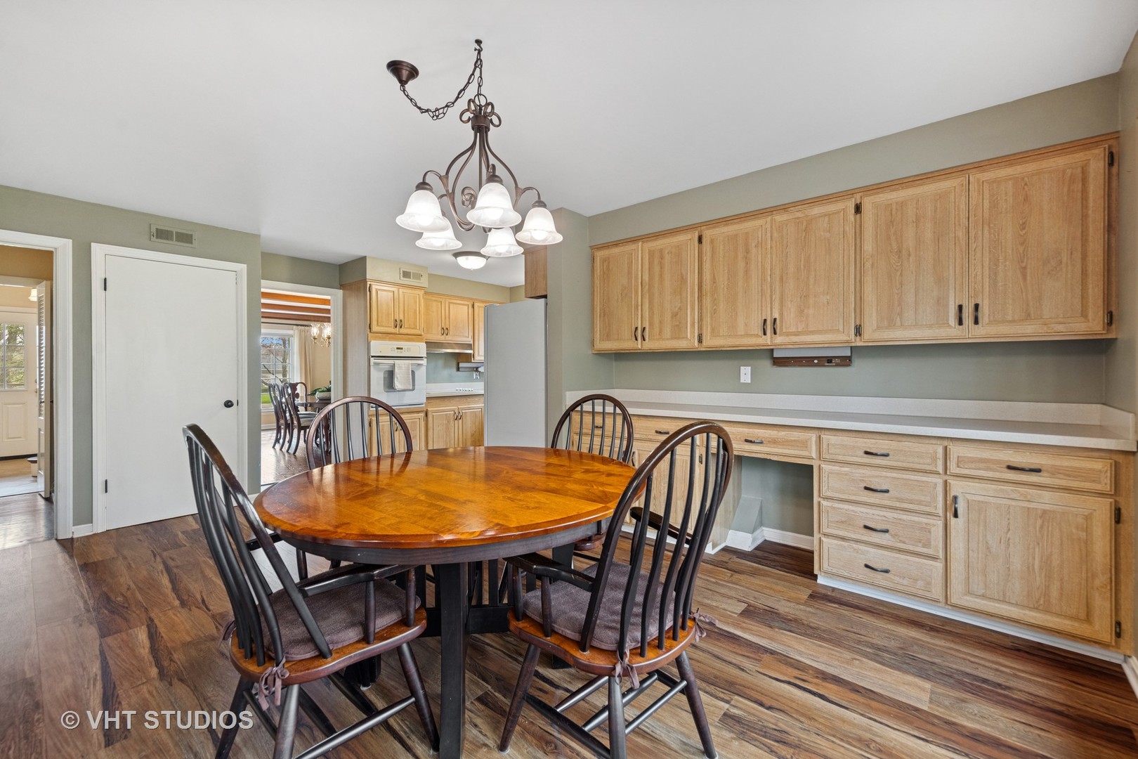 1200 Woodview Road Burr Ridge, IL 60527 - Photo 8 of 22 a view of a dining room with furniture and wooden floor
