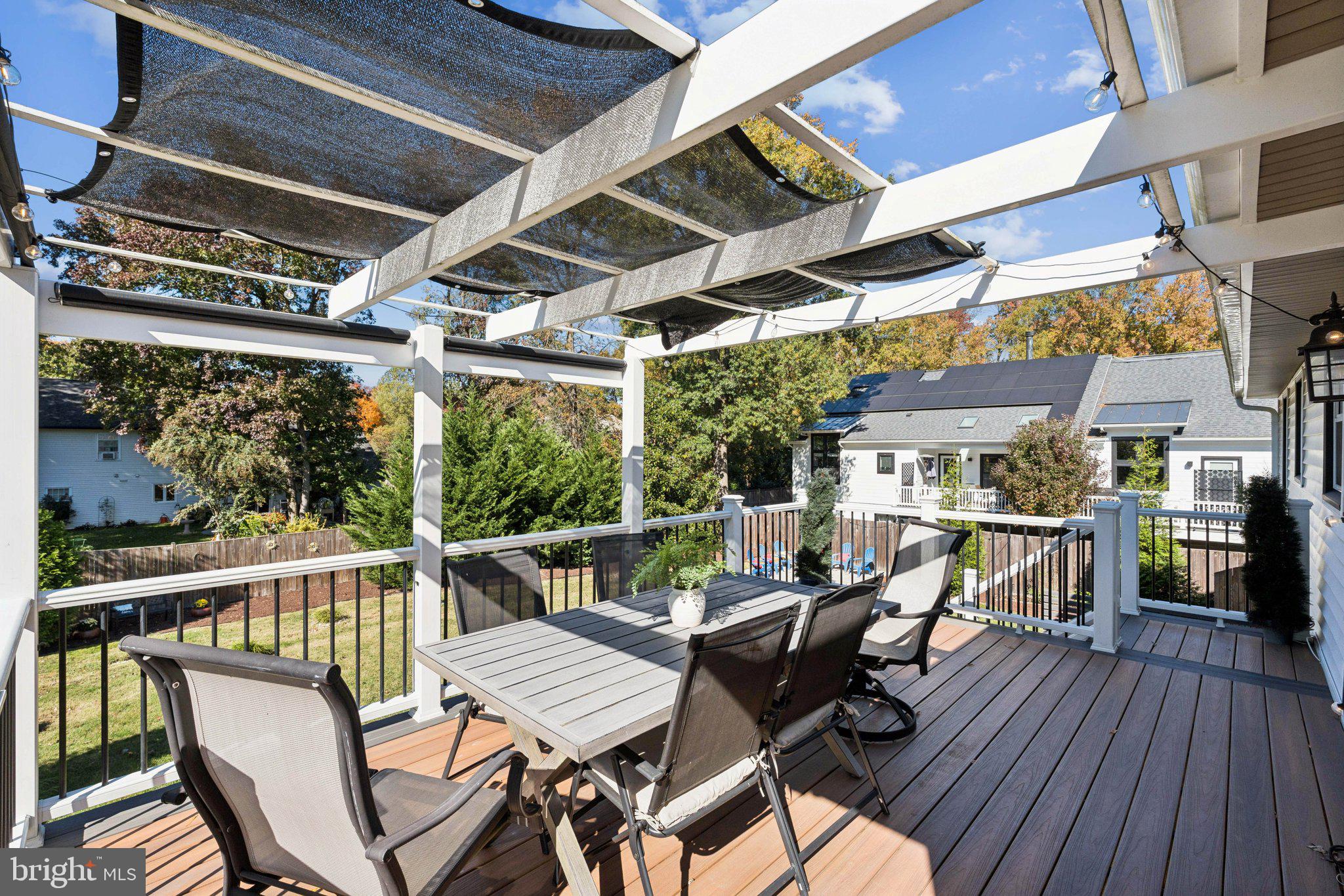 8518 Riverside Road Alexandria, VA 22308 - Photo 29 of 34 a view of a patio with table and chairs and wooden floor