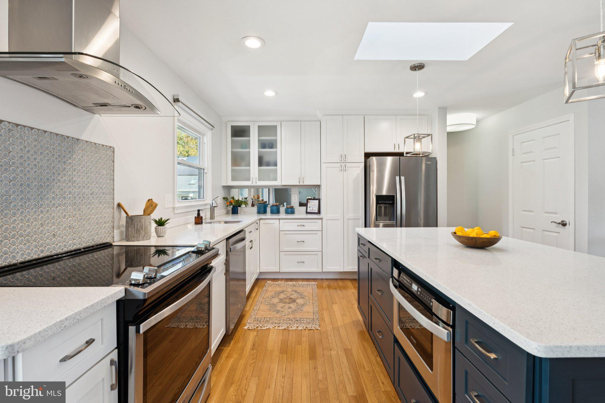 8518 Riverside Road Alexandria, VA 22308 - Photo 6 of 34 a kitchen with a sink a stove and refrigerator