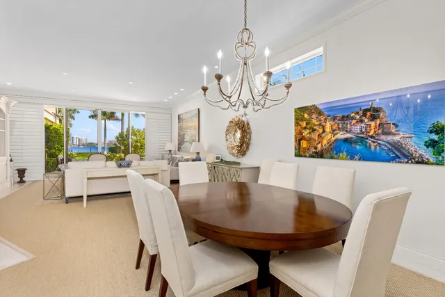 a view of a dining room with furniture and chandelier