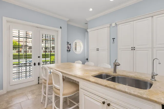 a kitchen with a sink cabinets and window