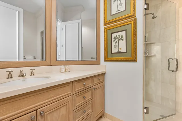 a bedroom with a bed and a night stand