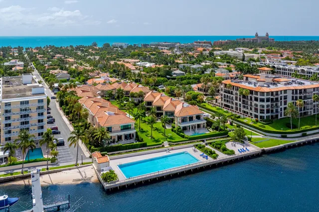 an aerial view of residential houses with yard