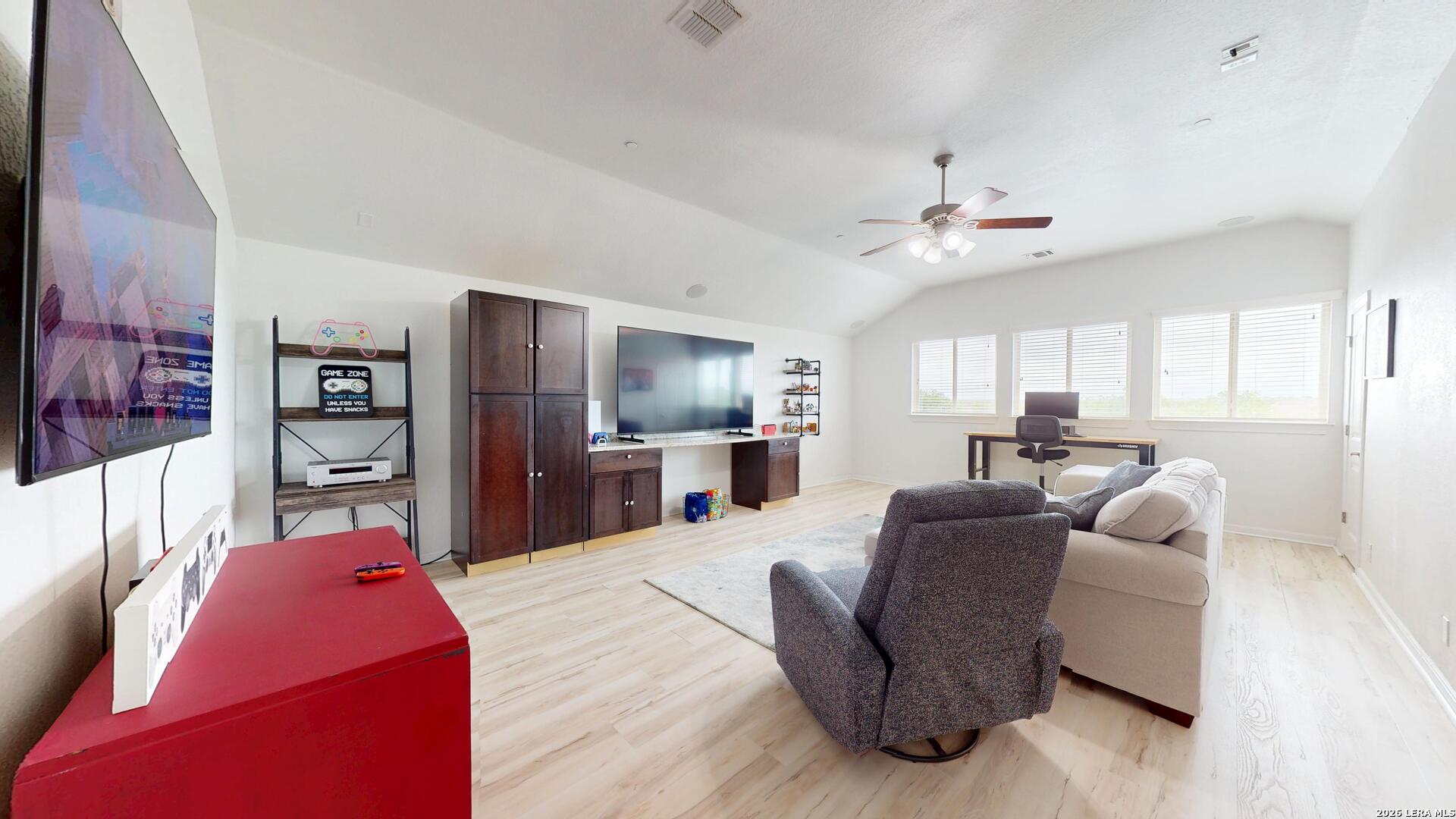 10111 Shallow Bank Converse, TX 78109 - Photo 50 of 65 a living room with furniture kitchen view and a flat screen tv