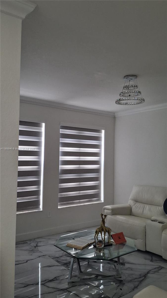 a living room with furniture and a window