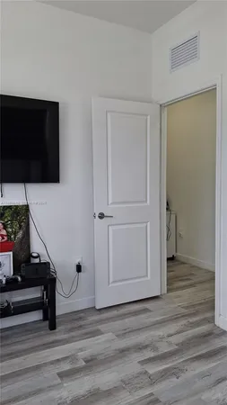 a view of a livingroom with wooden floor