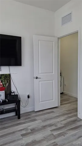 a view of a livingroom with wooden floor