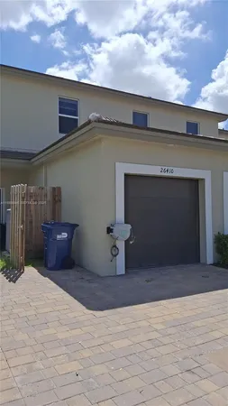 a front view of a house with a garage