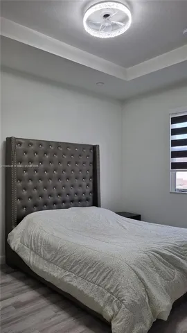 a bedroom with a bed and a sink