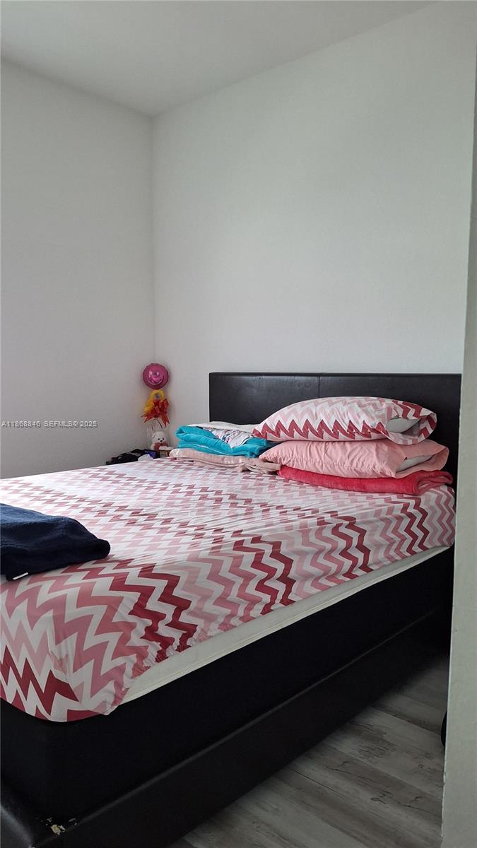 26410 Southwest 148th Court Homestead, FL 33032 - Photo 21 of 42 a bed room with a bed