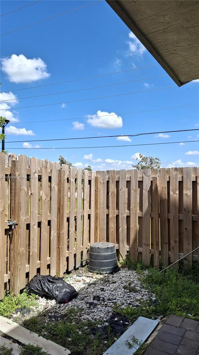 26410 Southwest 148th Court Homestead, FL 33032 - Photo 26 of 42 a view of a house with a yard