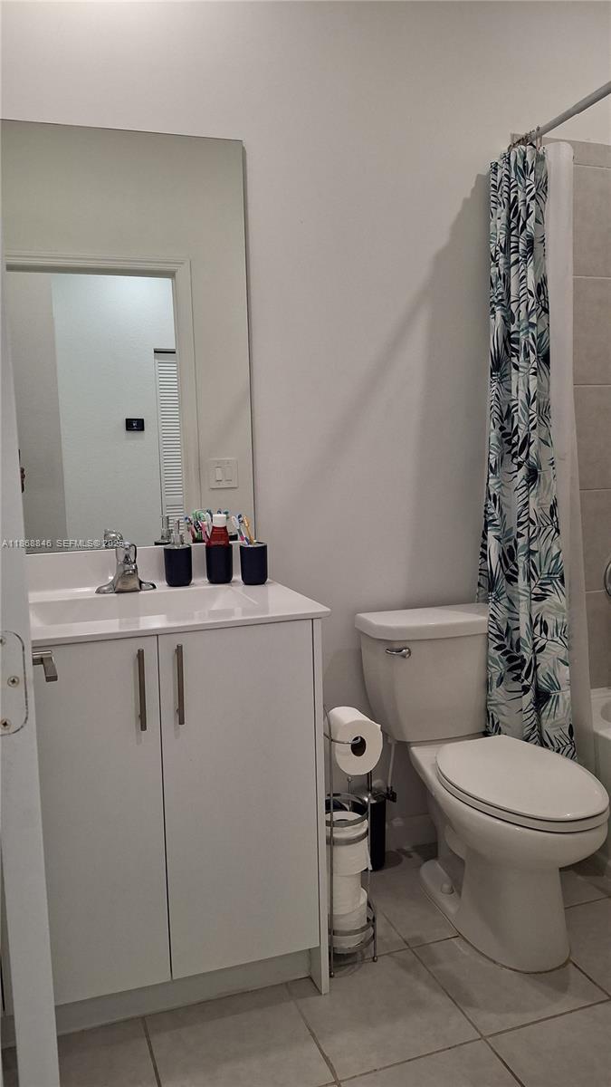 26410 Southwest 148th Court Homestead, FL 33032 - Photo 28 of 42 a bathroom with a sink toilet and mirror