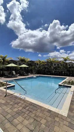 a kitchen with stainless steel appliances a refrigerator a stove a sink and a stove