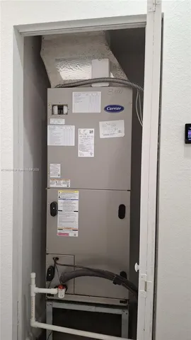 a front view of a house with a garden and yard