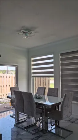 a view of a livingroom with furniture and a table