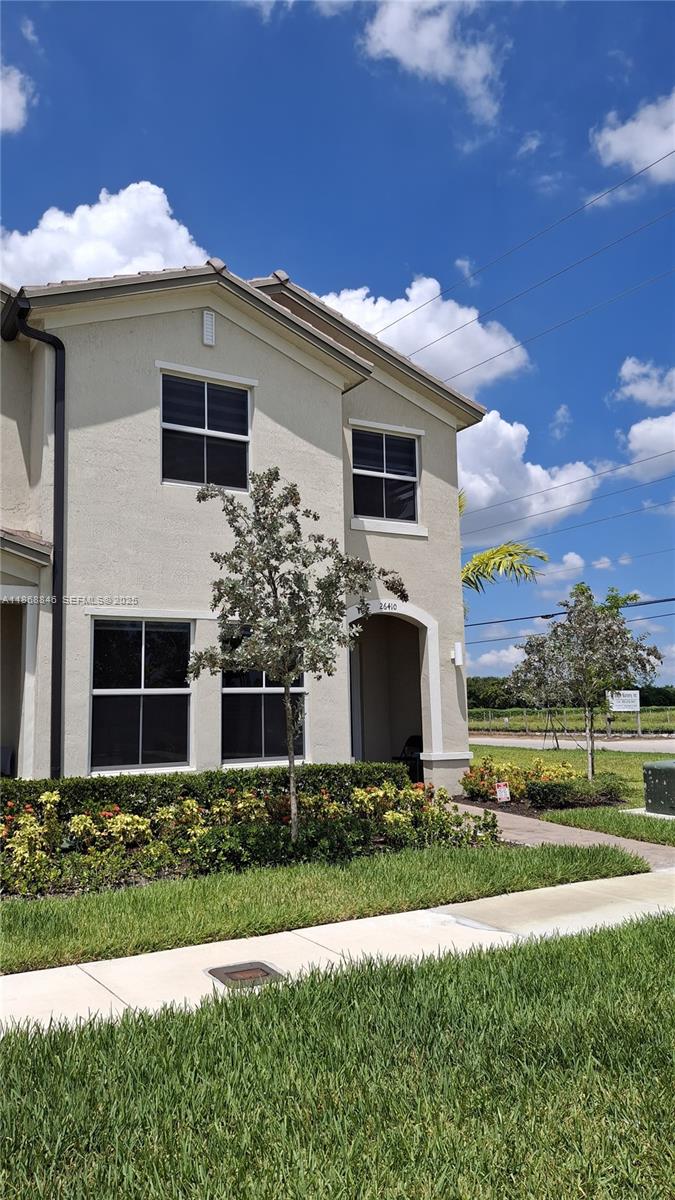 26410 Southwest 148th Court Homestead, FL 33032 - Photo 42 of 42 a front view of a house with a yard