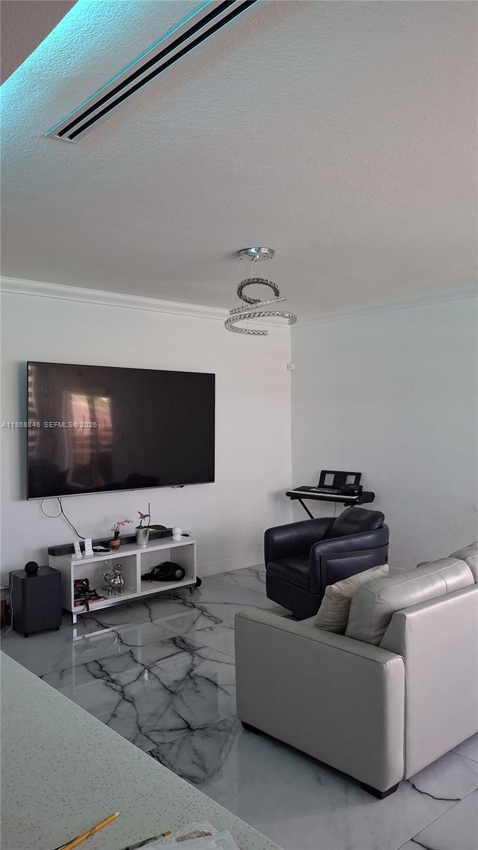 26410 Southwest 148th Court Homestead, FL 33032 - Photo 7 of 42 a living room with furniture and a flat screen tv