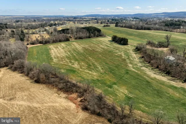 a view of a lake with beach and city view