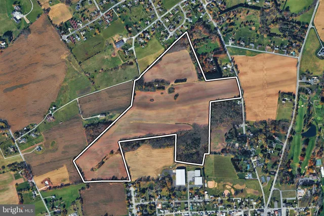 a aerial view of a house with backyard