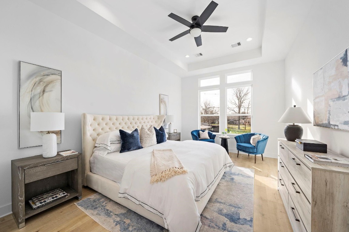 309 East 43rd Street Houston, TX 77022 - Photo 8 of 17 a bedroom with a bed a large window and flat screen tv