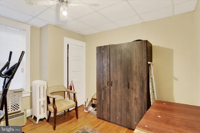 a view of a bedroom with furniture and a window