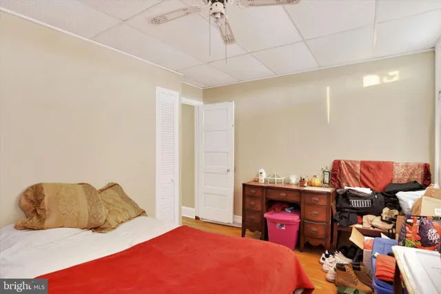 a bedroom with a bed and a couch