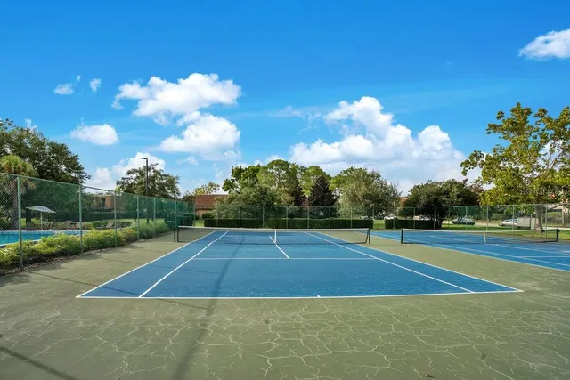 a view of an outdoor space and tennis court