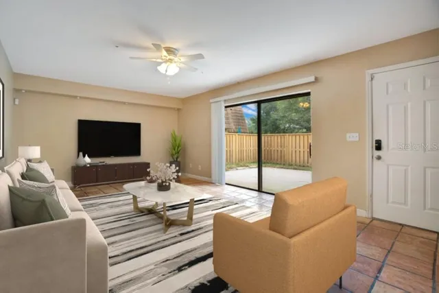 a living room with furniture and a flat screen tv