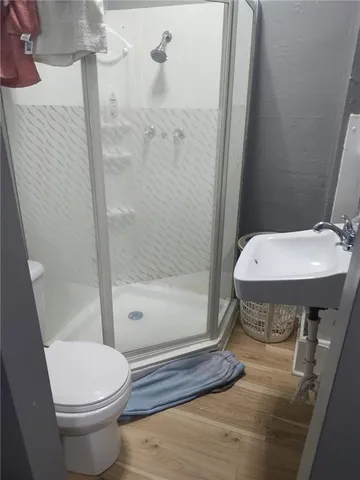 a kitchen with a sink and a refrigerator