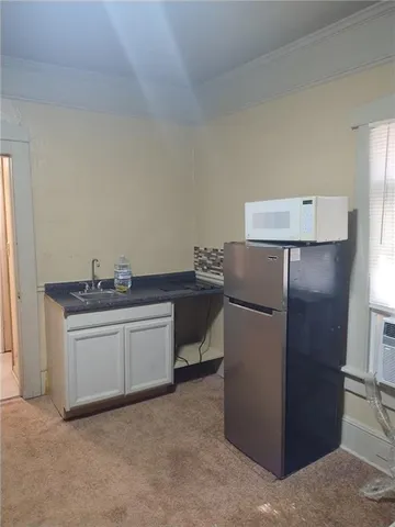 a hallway with a washer and dryer
