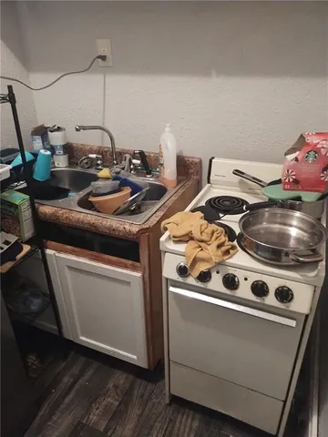 a spacious bedroom with a bed and a window