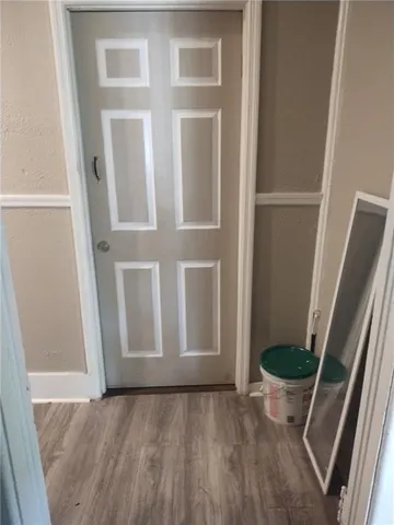 a bathroom with a toilet a sink and a mirror