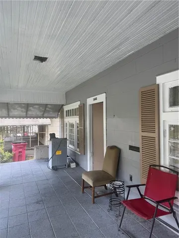 an empty room with wooden floor and a window