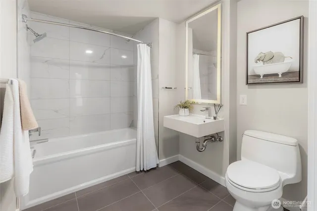 a bathroom with a sink toilet and vanity