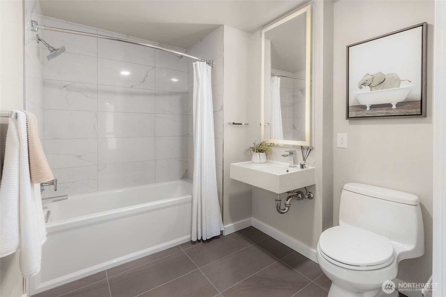 450 South Main Street, Unit 901 Seattle, WA 98104 - Photo 12 of 36 a bathroom with a sink toilet and vanity