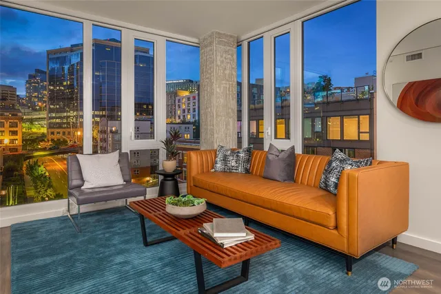a living room with furniture and a large window