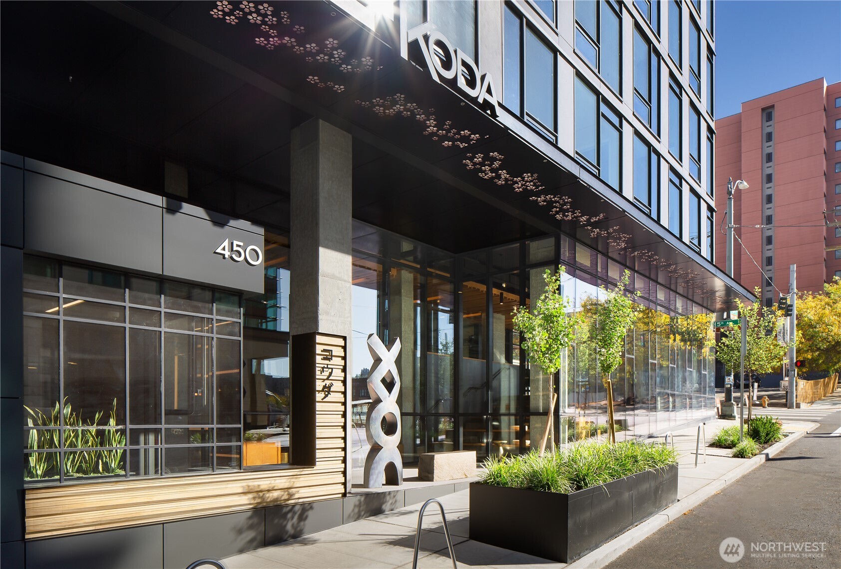 450 South Main Street, Unit 901 Seattle, WA 98104 - Photo 34 of 36 front view of a building with a potted plant